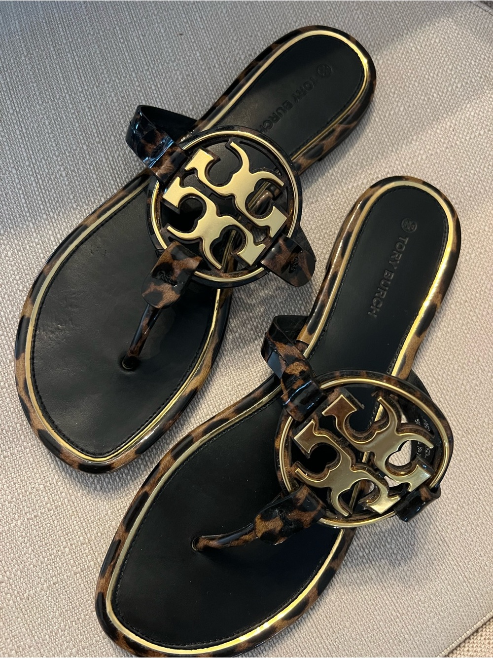 Tory Burch Black and Leopard Logo Thong Sandals with Gold Emblem